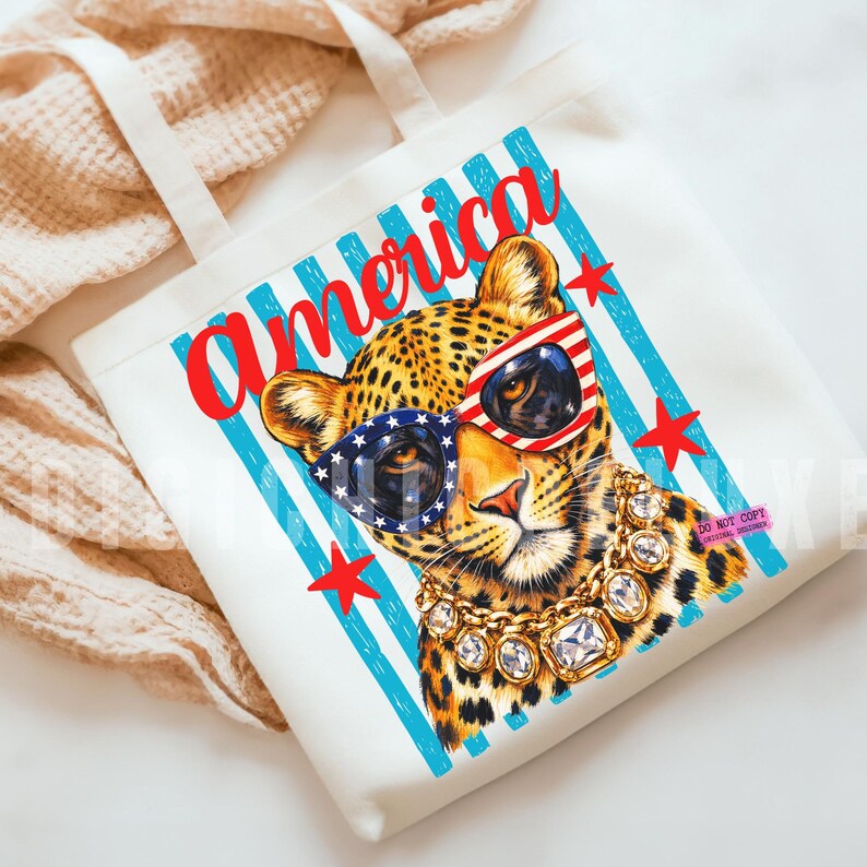 Patriotic leopard PNG design featuring glamorous leopard wearing American flag sunglasses and chunky gold jewelry on retro blue striped background. Trendy USA coquette animal graphic perfect for 4th of July shirts, patriotic apparel, summer vacation tees, western glam fashion, Independence Day party outfit, leopard lover gift, sublimation PNG, DTF transfer, print on demand design, tumbler wrap, mug design, wall art printable, boutique graphic tee, trendy Americana aesthetic clipart.
