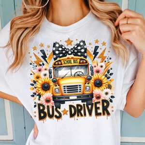 May include: White t-shirt with a yellow school bus graphic, black and white polka dot bow, sunflowers, and the text "BUS DRIVER" in gold glitter.