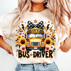 May include: A white t-shirt with a yellow school bus graphic, a black and white polka dot bow, sunflowers, and the text "BUS DRIVER" in gold glitter.
