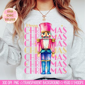 Hand-painted watercolor nutcracker soldier Christmas PNG design in vibrant pink, gold, and blue with festive stars and layered “Merry Christmas” lettering. Perfect for holiday shirts, Christmas party outfits, Nutcracker ballet gifts, winter home décor, festive wall art, seasonal apparel, cozy holiday decorations, and Christmas gift ideas for women and kids.