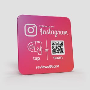May include: A square, pink gradient card with rounded corners. The Instagram logo and text "Follow us on Instagram" are at the top. Below are icons and text for "tap" and "scan" with a QR code. The text "reviewscard" is at the bottom.