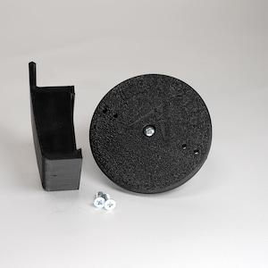 3D-printed traditional vinyl siding clip and circular mounting base for a Blink camera, include screws.
