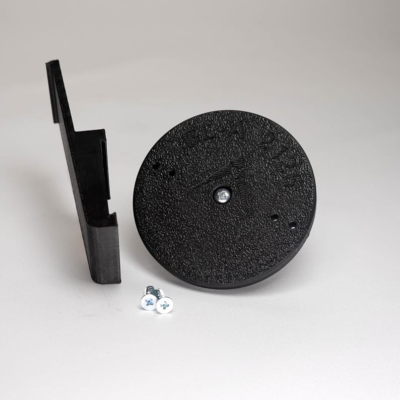 3D-printed plank siding clip and circular mounting base for a Blink camera, include screws.