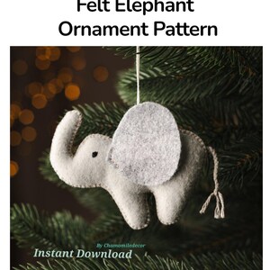 May include: A light gray felt elephant ornament with a darker gray ear, a small black eye, and a braided tail, hanging by a string. The text reads Felt Elephant Ornament Pattern, By Chamomiledecor, and Instant Download.