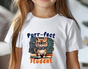 May include: White t-shirt with a graphic of a cat wearing glasses and a bow tie sitting on top of books. The text "Purr-fect Student" is printed on the shirt.