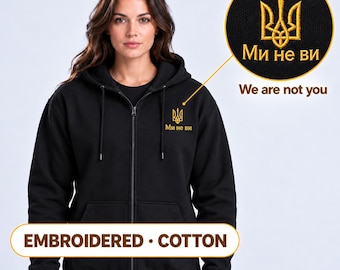 Women's Black Ukrainian Zip-Up Hoodie with Gold Tryzub Embroidery, “Ми не ви” Left Chest Design, 80/20 Cotton Blend, Made in Ukraine