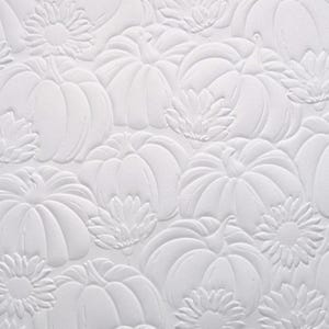 May include: White embossed paper with a repeating pattern of pumpkins and flowers. The design is raised and creates a textured surface.
