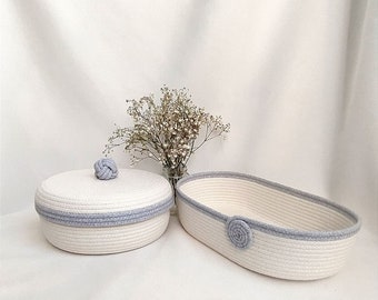 Set of two jute baskets. Basket with lid diameter 16 cm, height 7 cm. Oval basket 24*12 height 6 cm