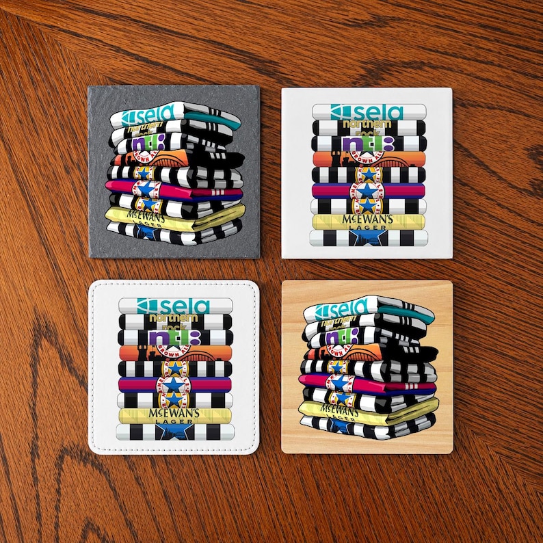 May include: Four square coasters with a stacked design. Each coaster features a colorful illustration of stacked items with the text "sela northern" and "MCEWAN'S LAGER". The coasters are on a wooden surface.