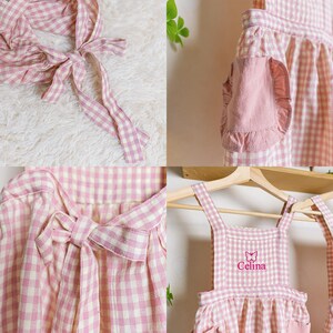 May include: Pink and white gingham apron with a butterfly and the name "Celina" embroidered on the front. The apron has adjustable straps and a large pocket.
