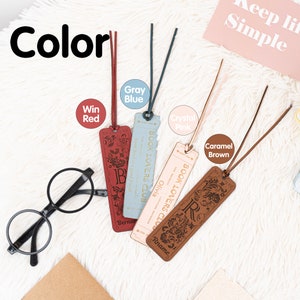 May include: Four leather bookmarks with different colors and designs. The bookmarks are labeled with the colors: Win Red, Gray Blue, Crystal Pink, and Caramel Brown. Each bookmark has the text "BOOK LOVERS CLUB" and a name on it.
