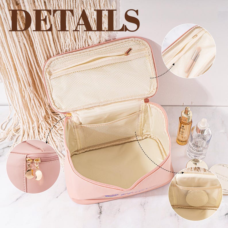May include: Pink travel makeup bag with multiple compartments and a zipper closure. The bag is open to reveal a mesh pocket and a zippered pocket. The bag has a gold zipper pull.
