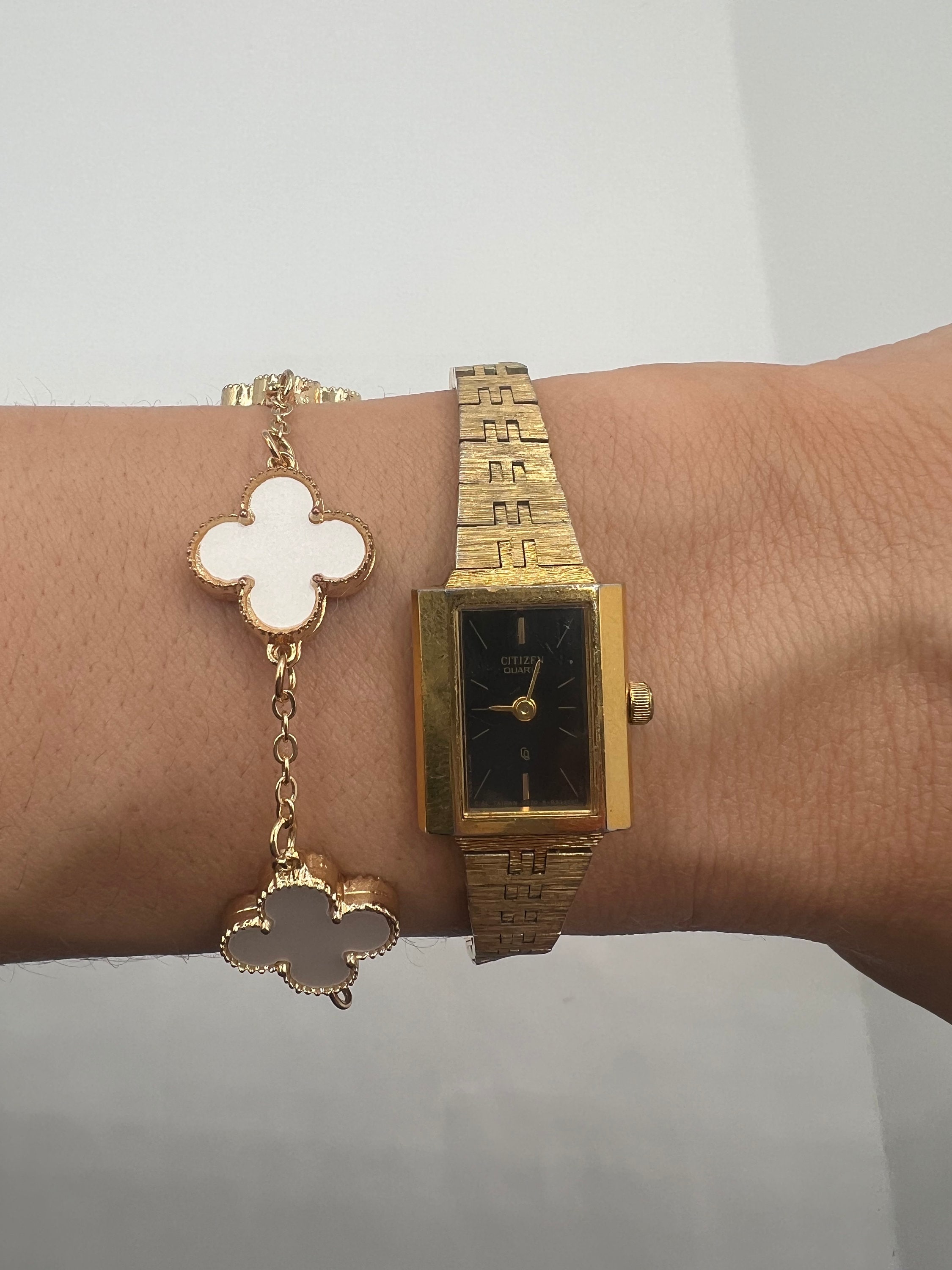 Gold citizen clearance watch black face