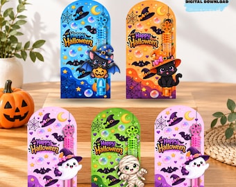 May include: Five rectangular Halloween bubble wand holders featuring colorful designs with bats, spiderwebs, moons, and stars. Each card displays the text Happy Halloween and includes a plastic bubble wand with a character like a bat, cat, or mummy.