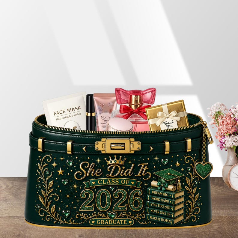 May include: A dark green cosmetic bag with gold accents, filled with beauty products. The bag features the text "She Did It, Class of 2026, Graduate" and a graduation cap design. Includes a face mask, perfume, and a gift box.
