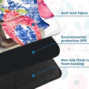 May include: A close-up of a mouse pad with a floral design featuring a pink and blue ginger jar. The mouse pad has a soft tech fabric top, environmental protection XPE, and a non-slip thick rubber foam backing.