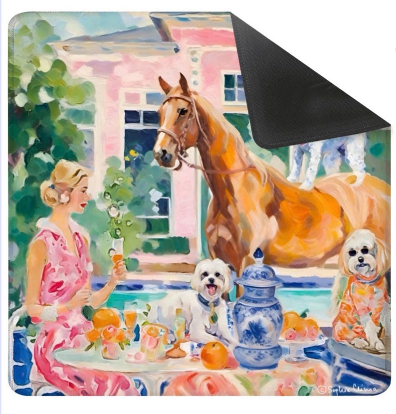 May include: A decorative mouse pad featuring a colorful painting of a woman at a table with dogs, a horse, and a pink building in the background. The artwork has a vintage, impressionistic style with vibrant colors.