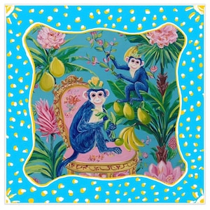 May include: Square decorative scarf featuring a vibrant illustration of blue monkeys in a tropical scene. The design includes lush greenery, pink flowers, and yellow fruit, set against a turquoise backdrop with a blue and white polka dot border.