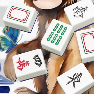May include: White Mahjong tiles with red, green, and black symbols and designs are scattered across a watercolor illustration of a monkey. The tiles have a blue border. A butterfly and a blue and white vase are also visible.