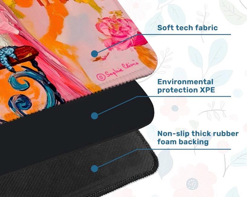 May include: A close-up of a mousepad with a floral design in pink, orange, and blue. The mousepad has a soft tech fabric surface, environmental protection XPE, and a non-slip thick rubber foam backing. The artist's signature, Sophie Clima, is visible.