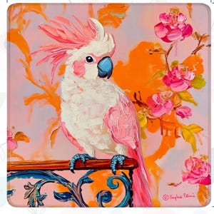 May include: A square mousepad featuring a vibrant painting of a white and pink cockatoo perched on a decorative railing. The background is a blend of orange and pink hues with floral accents. The artist's signature is visible.