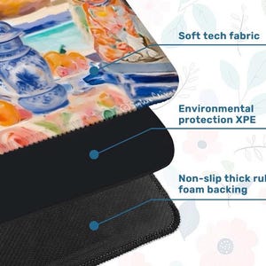 May include: A close-up of a mousepad with a colorful painting of a still life with blue and white porcelain and oranges. The mousepad has a soft tech fabric, environmental protection XPE, and a non-slip thick rubber foam backing.