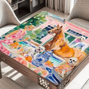 May include: A wooden coffee table with a colorful, artistic painting on the tabletop. The painting depicts a horse, small dogs, and a woman in a pink dress. The table is surrounded by chairs.