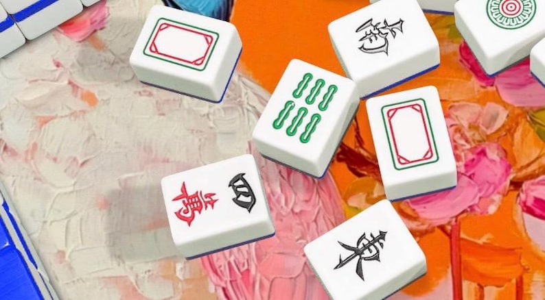 May include: White Mahjong tiles with red, green, and black symbols and designs are scattered on a colorful background. The tiles feature various symbols and patterns, including rectangles, lines, and Chinese characters. The game pieces are arranged in a visually appealing manner.