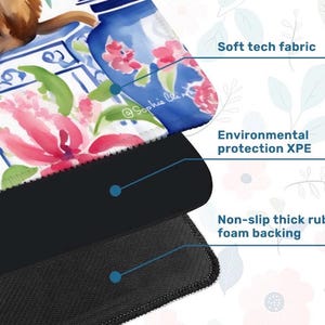May include: A mouse pad with a floral design featuring pink flowers and blue vases. The mouse pad has a soft tech fabric surface, environmental protection XPE, and a non-slip thick rubber foam backing. The artist's signature, "@Sophie Clin", is visible.
