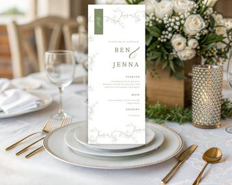 May include: A wedding menu card with the names "Ben & Jenna" in elegant script. The menu features a green accent and floral design, with the menu items listed below. The card is placed on a table setting with gold cutlery and white plates.