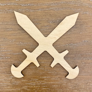 May include: Two wooden swords crossed, featuring a light brown color. Each sword has a handle and a pointed blade. The swords are set against a light brown wooden background.