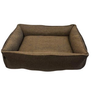 May include: A rectangular dog bed with a brown fabric exterior and a darker brown trim. The bed has raised sides for added comfort and support. The interior is a lighter shade of brown, creating a cozy space for pets.