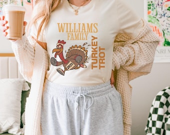 May include: A white t-shirt with the text "Williams Family Turkey Trot 2023" and a cartoon turkey running.