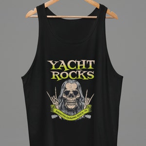 May include: Black tank top with a graphic of a skull with long hair, wearing a necklace and making the rock and roll hand gesture. The text "Yacht Rocks" is above the skull and "Smooth Sailing Since '75" is below the skull.