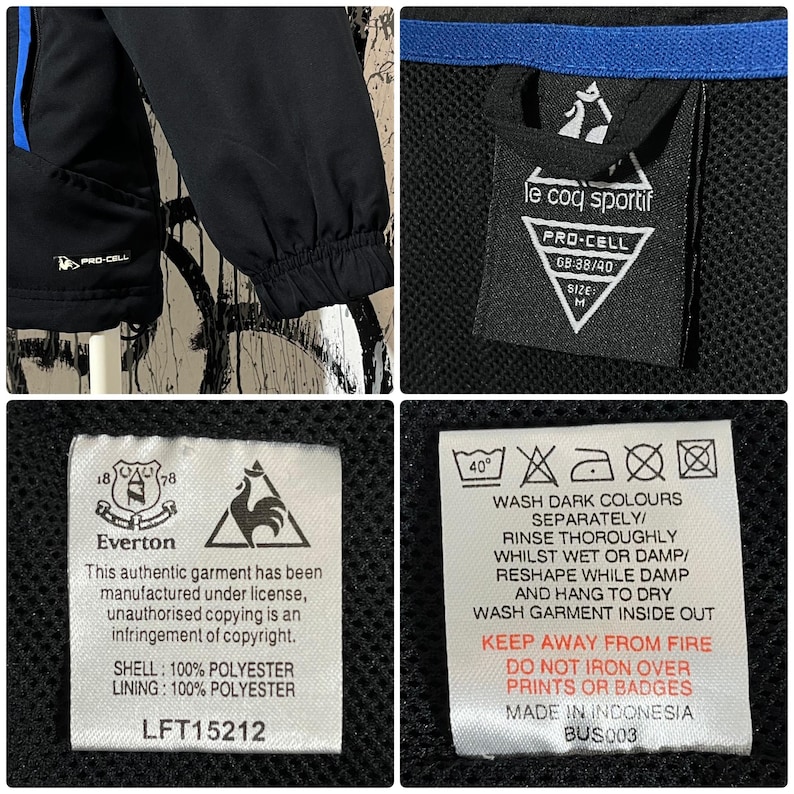 K&ouml;nnte beinhalten: Schwarze und blaue Sportjacke mit dem Logo "le coq sportif" und dem Etikett "Everton". Die Jacke hat ein "PRO-CELL"-Etikett und ein Gr&ouml;&szlig;enetikett M. Die Jacke besteht aus 100 % Polyester.