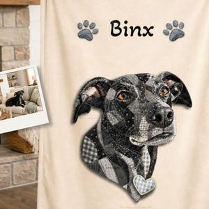 May include: Cream-colored custom pet portrait blanket featuring a dog named Binx. The dog's portrait is in black and gray patchwork style. The blanket has paw prints and the text "Custom Pet Portrait Blanket" and "Handcrafted Style".