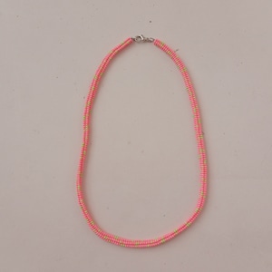 May include: A pink and green beaded necklace with a silver clasp.