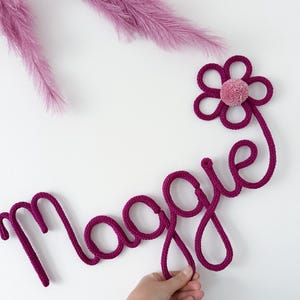 Personalized Knitted Wire Name Sign: Nursery Decor with Flower & Pom-Pom
