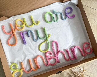 You Are My Sunshine Sign in rainbow colours. Baby and kids wall decoration.