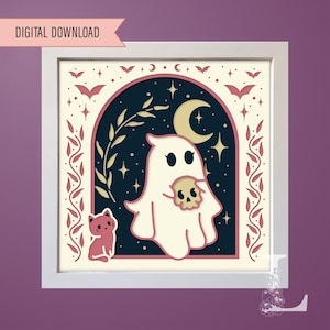 May include: A white ghost holding a skull in a night sky with stars and a crescent moon. The ghost is in a frame with a pink and white border. There is a pink cat in the bottom left corner of the image.
