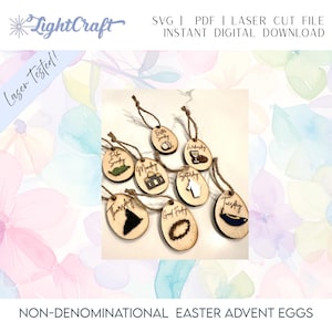 May include: A collection of wooden Easter advent eggs, each with a unique laser-cut design and text such as "Easter Sunday", "Monday", "Wednesday", "Saturday", "Thursday", "Good Friday", and "Tuesday". The eggs are strung on twine. The text "Laser Tested!" is visible.