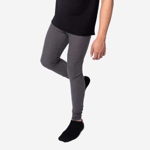May include: A pair of grey leggings with a heather texture. The leggings are fitted and have a slim leg.