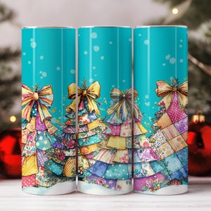 May include: Three teal-colored tumblers with a Christmas tree design. Each tumbler features a patchwork Christmas tree with a large bow at the top. The trees have colorful, patterned layers and are set against a background of falling white dots.