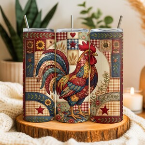 May include: Three stainless steel insulated tumblers with a rooster design. The design features a colorful rooster with red, blue, and yellow feathers, set against a patchwork background with stars, hearts, and sunflowers. Each tumbler has a silver straw.