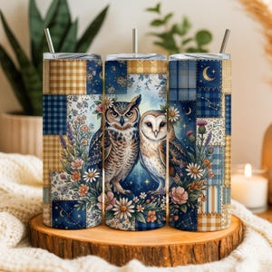 May include: Three stainless steel insulated tumblers with a patchwork design featuring owls, flowers, and celestial elements. The tumblers have a straw and are decorated with blue, tan, and floral patterns. The design includes an owl couple and a night sky.