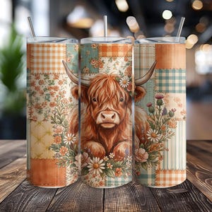 May include: Three stainless steel tumblers with lids and straws. Each tumbler features a patchwork design with a Highland cow illustration surrounded by flowers. The tumblers have a mix of floral, plaid, and striped patterns in shades of orange, blue, and cream.