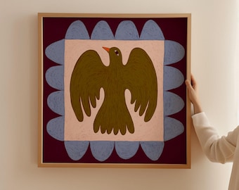 May include: A framed artwork featuring a stylized bird illustration. The bird is olive green with an orange beak, set against a light pink square. The background is a deep burgundy with blue scalloped edges, all within a wooden frame.