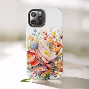 A floral iPhone case adorned with a floral pattern featuring pink, red, and yellow blooms, perfect for those seeking a flower phone case.