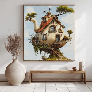 May include: A framed print of a whimsical teapot-shaped house with a red tile roof, windows, and a door. The house is perched on a tree trunk with stairs leading up to the entrance. Green foliage and small trees adorn the structure against a blue sky.