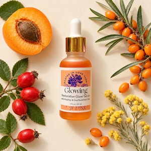 May include: A glass dropper bottle of orange restorative glow serum with a gold cap. The label reads Rooted in Love Farm, Glowing, Restorative Glow Serum with Rosehip & Sea Buckthorn Oils, 1 fl oz / 30 ml. Surrounded by apricots, rosehips, and berries.